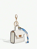 Close-up view of mini key ring holder keychain coin purse earphone pouch bag charm with chain strap, coin purse format, key ring detail for small-item storage