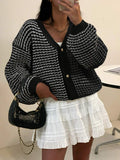 Back view of Women’s Plaid V-Neck Button-Up Cardigan for Effortless Style and Comfort loose drop shoulder fit
