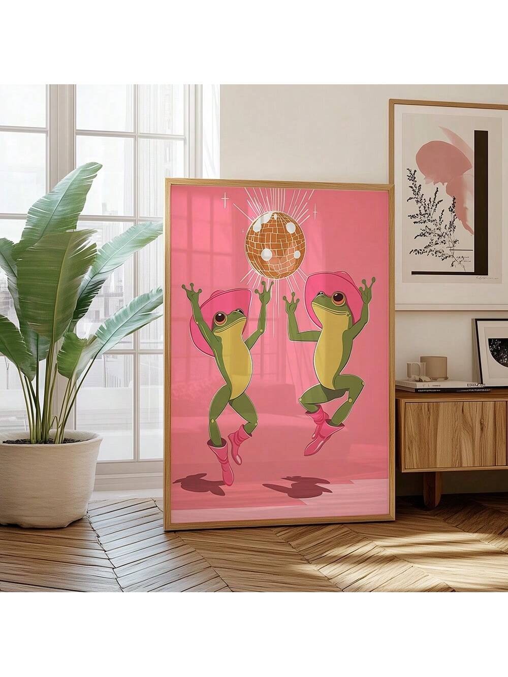 Bring joyful charm to your space with this Whimsical Dancing Frog Art Print. Featuring a lively frog in pink tones, it blends playful fun with a touch of western cowgirl style. Perfect for adding quirky personality and a pop of color to your home or office décor.