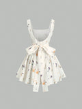 Floral dress with suspenders on a gray background
