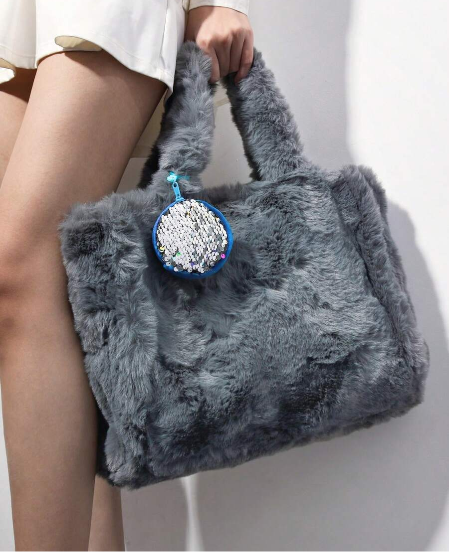 Elevate your everyday carry with this irresistibly plush tote bag set! Crafted from luxuriously soft faux fur in a gorgeous pink hue, it's the perfect companion for shopping trips, weekend adventures, and casual outings. The spacious design accommodates all your essentials while the fluffy texture adds an instant touch of fun and personality to any outfit. Whether you're heading to the market or meeting friends, this statement piece transforms ordinary moments into stylish ones. Soft, chic, and utterly deli