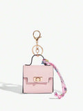 Close-up view of mini key ring holder keychain coin purse earphone pouch bag charm with chain strap, coin purse format, key ring detail for small-item storage