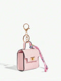 Close-up view of mini key ring holder keychain coin purse earphone pouch bag charm with chain strap, coin purse format, key ring detail for small-item storage
