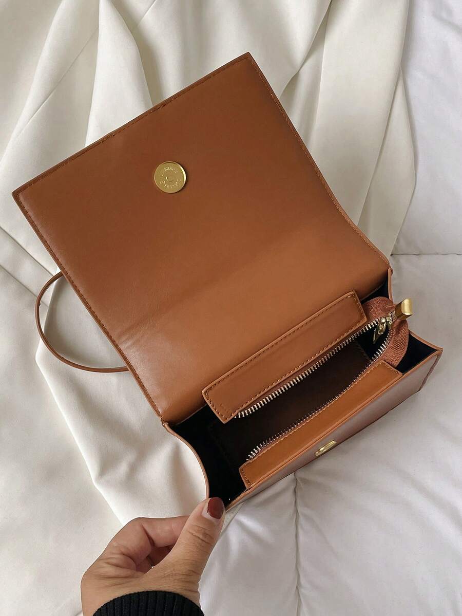 Detail of gold chain strap and hardware on retro box bag
