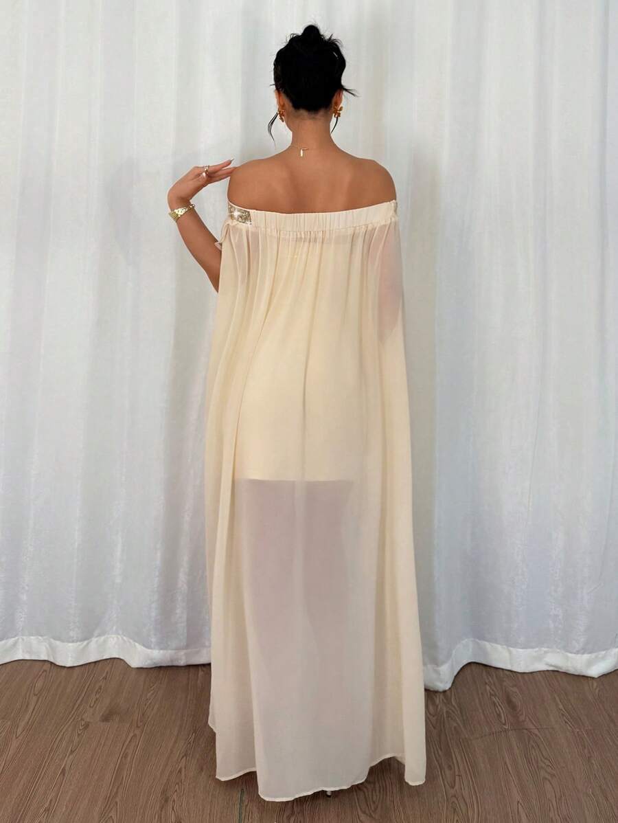 Flaunt your style with this elegant and playful off-shoulder chiffon dress. The flowy design and see-through fabric add a touch of grace and allure, making it perfect for any occasion. Sparkle and shine in this dress that's perfect for those who don't take themselves too seriously.