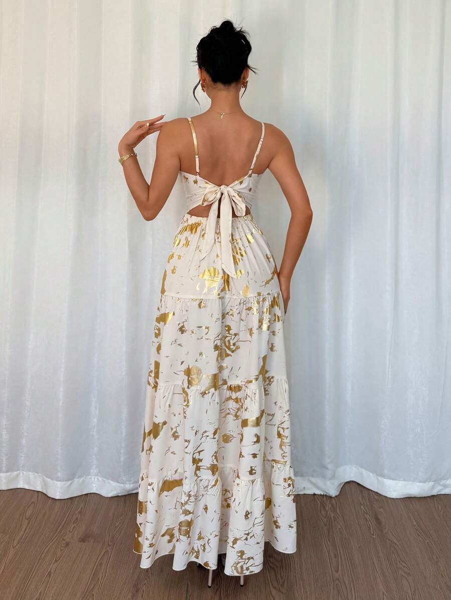 The perfect dress for a chic and playful look on your spring/summer vacations! This elegant French style dress features a stunning gold foil print and a flared design that will surely make you stand out. Embrace the quirky and fun side of fashion with this must-have piece!