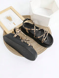 Leopard print flatform sandals flatlay with black footbed and animal print straps