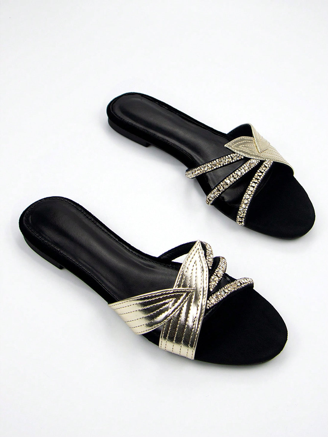 Step into style with our Black Velvet Mules that bring the party wherever you go! These sassy slip-ons feature dazzling gold leaf appliques and eye-catching rhinestones that'll make your feet the talk of the town. Comfy enough for everyday strutting but fancy enough for your wildest nights out – because who says you can't have fun AND fabulous feet?