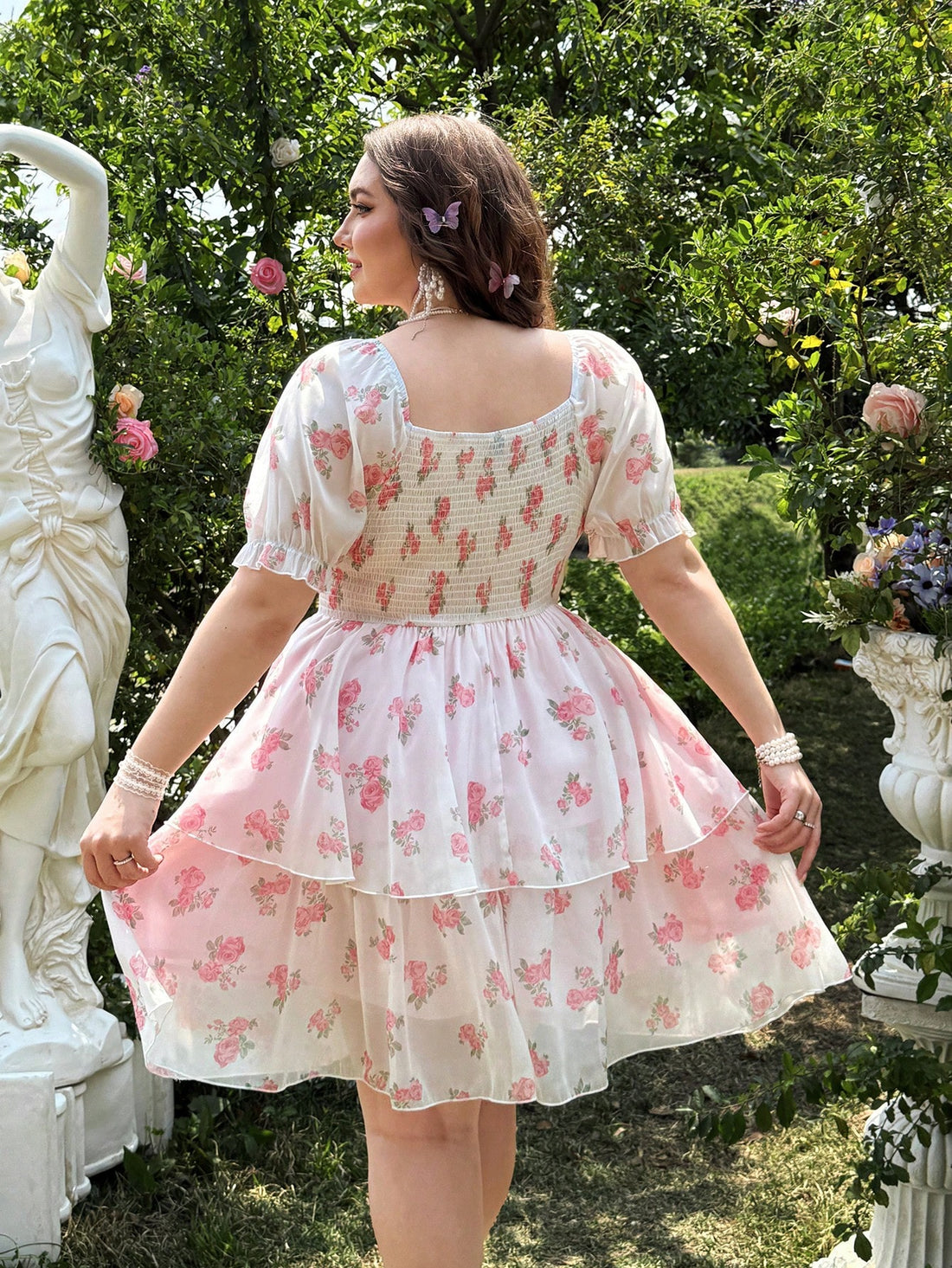Effortlessly elegant and oh-so-feminine, this plus size floral chiffon dress features a double layered hem for added flow and movement. Perfect for any occasion, it's a must-have for your wardrobe.