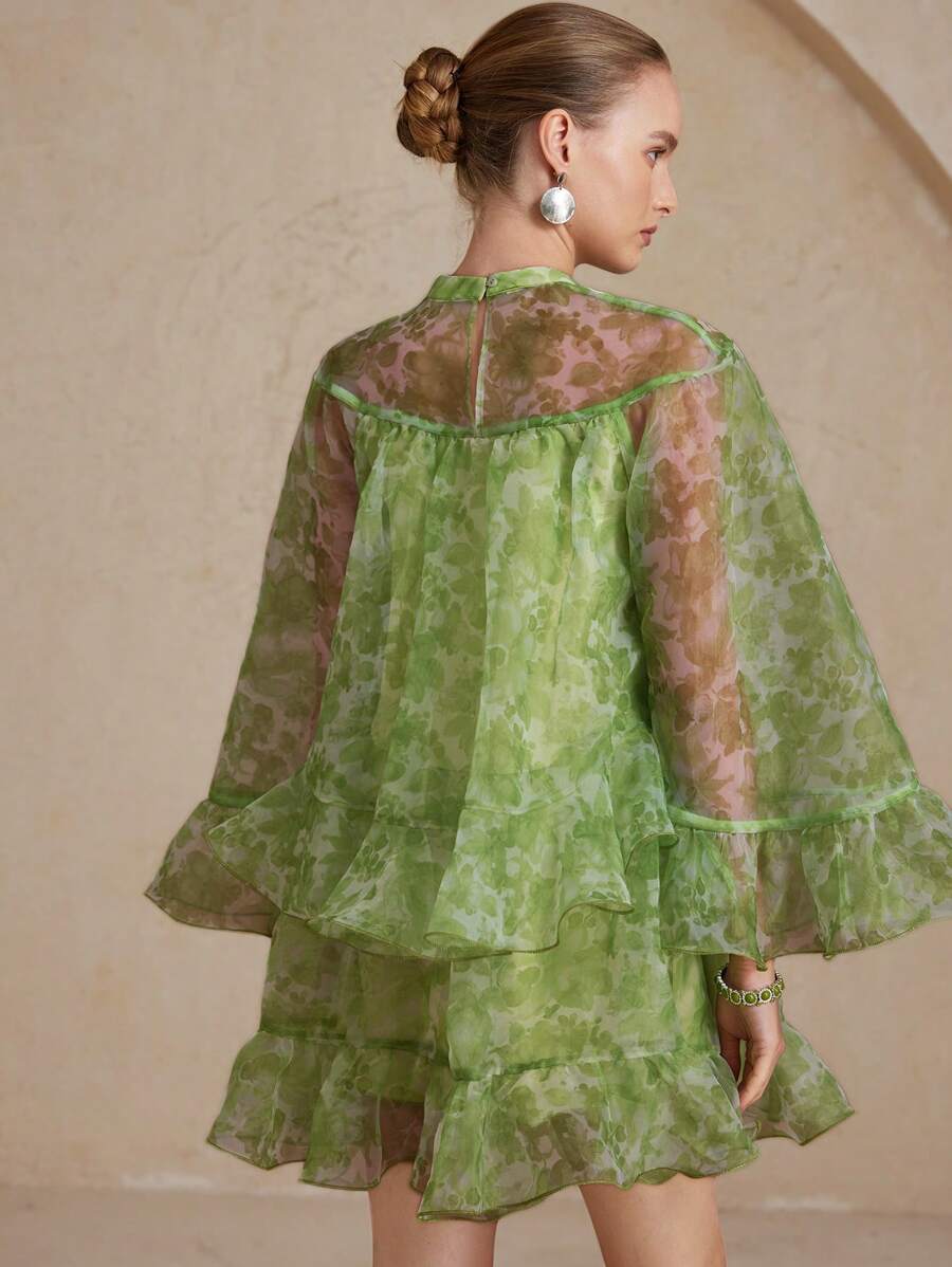 Step into romance with this Elegant Floral Organza Mini Dress, designed to charm on Valentine's Day. Its delicate floral organza fabric and long sleeves create a flirty yet graceful look, perfect for celebrating love. Light and airy, this mini dress offers comfort while making a stylish statement. Whether it's a date night or a festive gathering, this dress adds a playful touch to your special day.