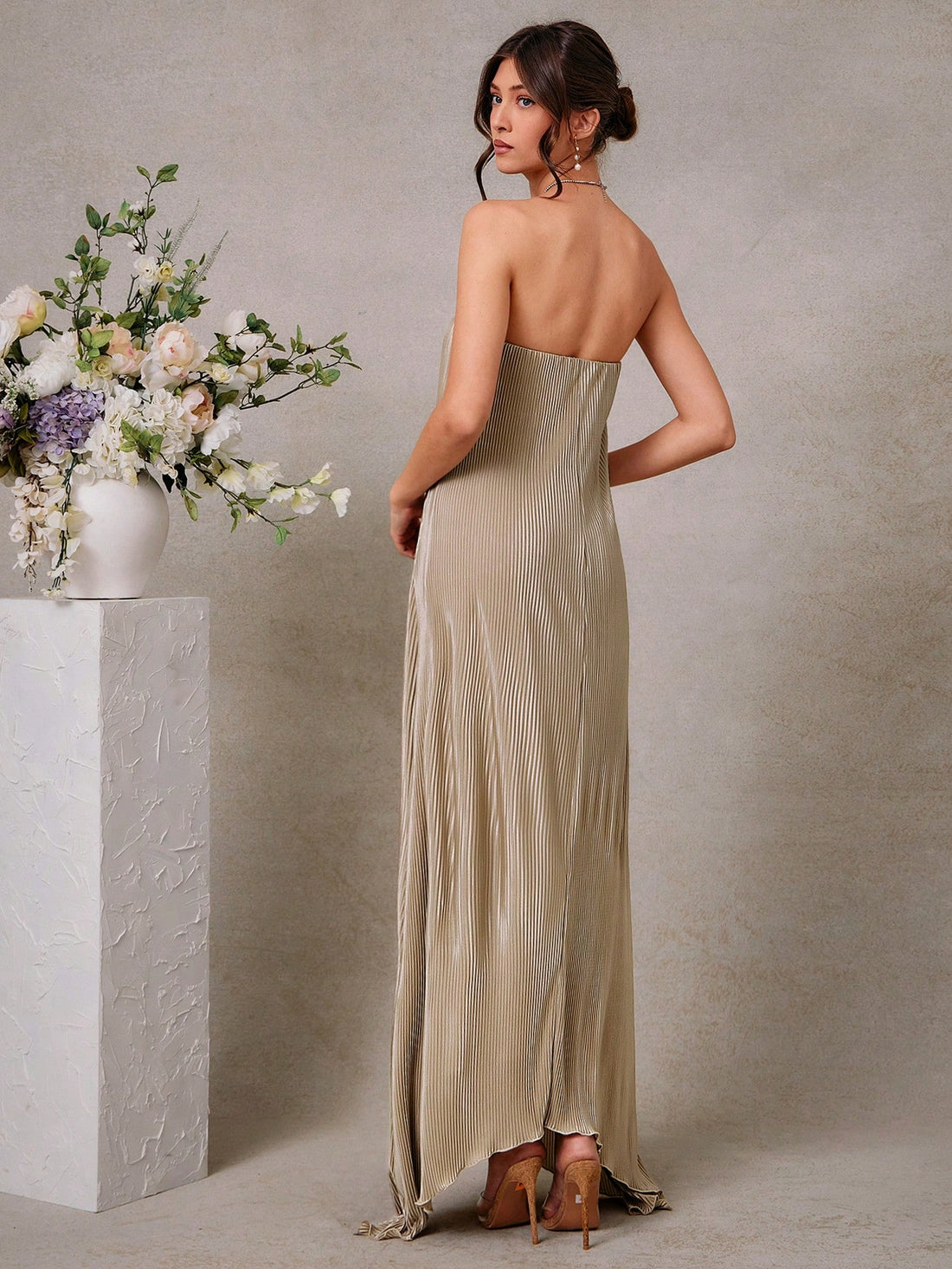 Step into the spotlight with this Chic Strapless Champagne Gold Satin Maxi Dress. Its smooth, silky fabric drapes effortlessly, while the strapless design lets you show off your shoulders with a flirty flair. Perfect for weddings or any formal occasion, this dress promises to keep you looking radiant and feeling fabulous all night long. Champagne dreams never looked so good!
