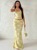 Front view of yellow metallic floral knit outfit set styled for evening wear