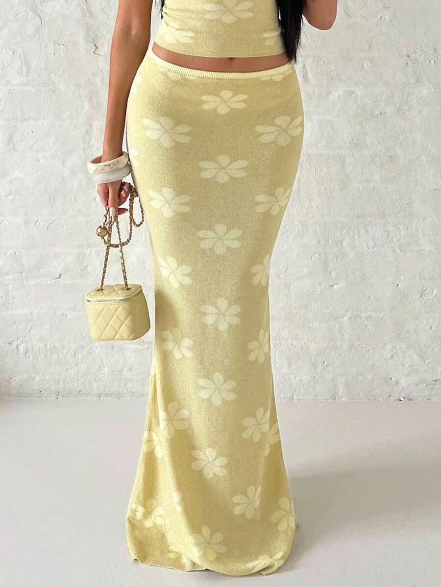 Close-up of yellow floral jacquard mermaid skirt with metallic knit shimmer