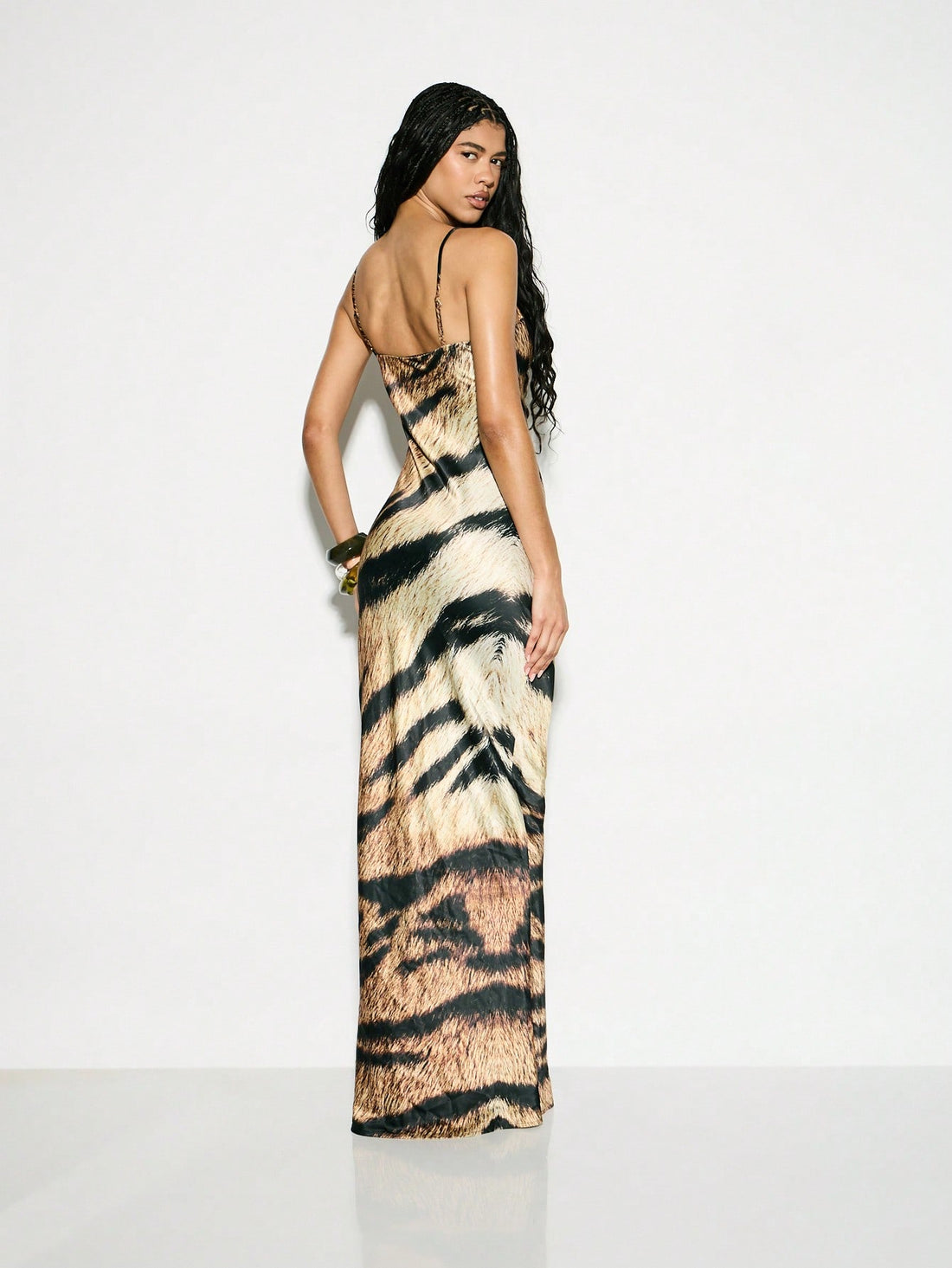 Turn heads and unleash your wild side with this Elegant Tiger Print Satin Maxi Dress. Featuring a silky-smooth satin finish and delicate lace trim, it’s the perfect playful choice for special occasions and weddings. Flowing maxi length adds graceful movement while the striking tiger print sets you apart in any crowd. Embrace confidence and fun wherever you go!