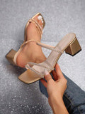 Metallic gold square toe rhinestone mule sandals with black outsole