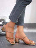 Side view of gold multi strap chunky heel mule sandals worn on foot