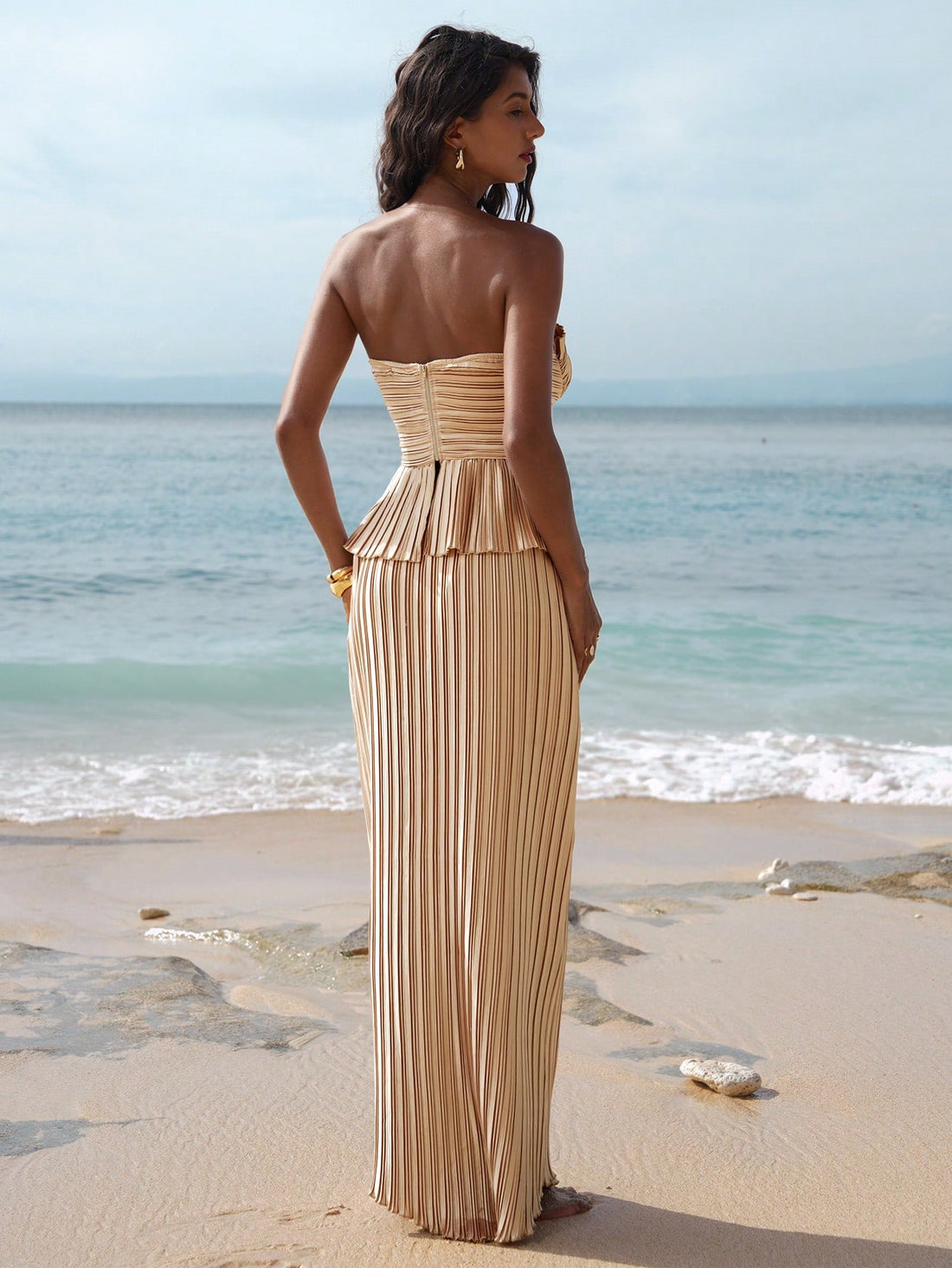 Elevate your evening wardrobe with this stunning two-piece set that's pure magic! The sleek bandeau top pairs perfectly with a flattering high-waist mermaid skirt, creating curves and confidence in one fabulous package. Designed for those cooler autumn and winter nights, this ensemble strikes the perfect balance between sophisticated and fun. Whether you're heading to a special event or a night out with friends, you'll turn heads and feel absolutely incredible. Dress it up with heels and jewelry, or keep it