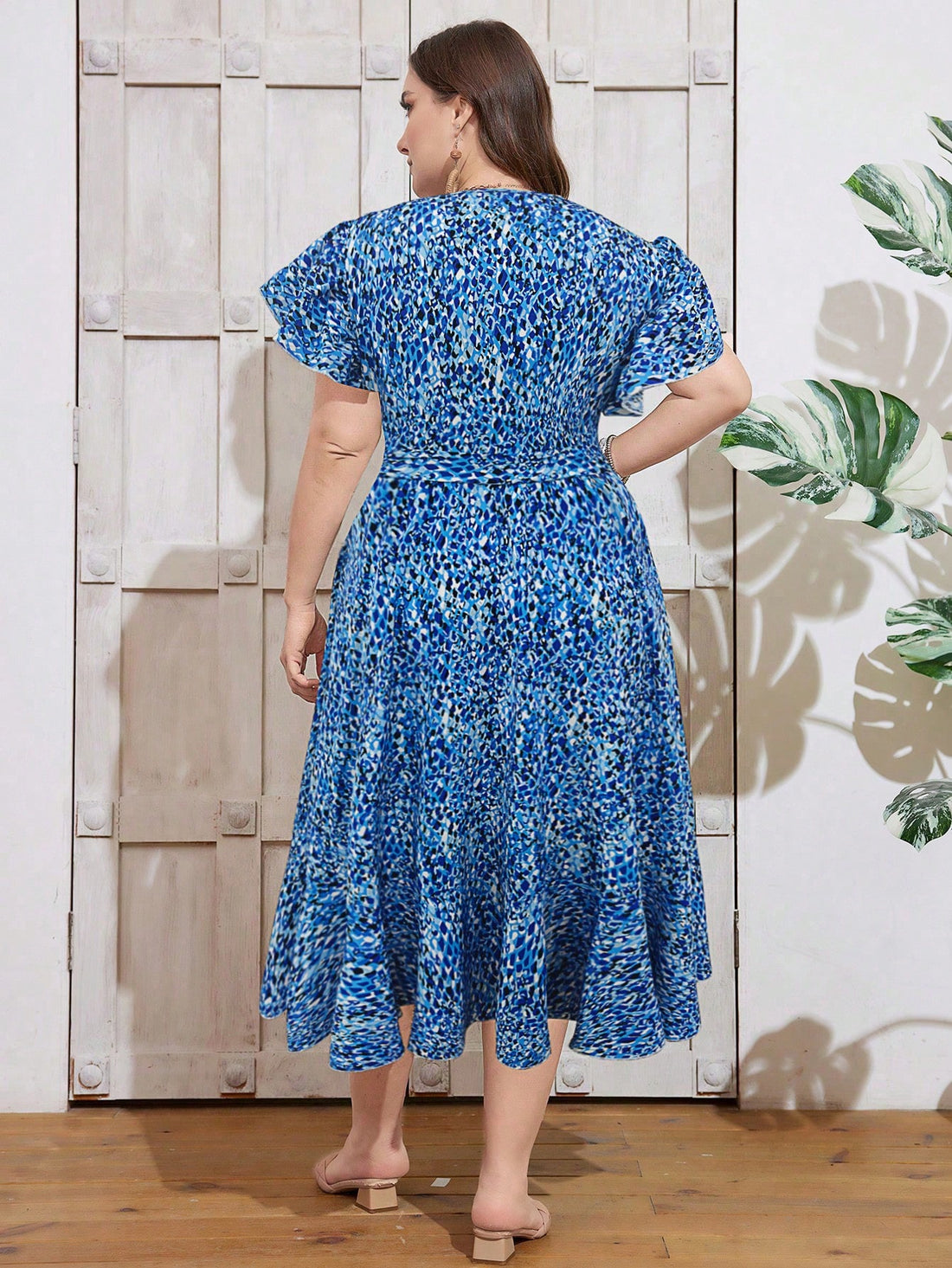 Embrace your summer goddess vibes in this flirty plus-size resort wrap dress! The eye-catching floral print dances across the flowing maxi silhouette, while the playful ruffled hem adds just the right amount of bounce to your step. Perfect for beachside brunches, sunset cocktails, or simply turning heads wherever your warm-weather adventures take you!