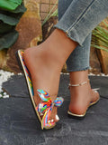 Close-up of rainbow bow slide sandal on foot outdoors