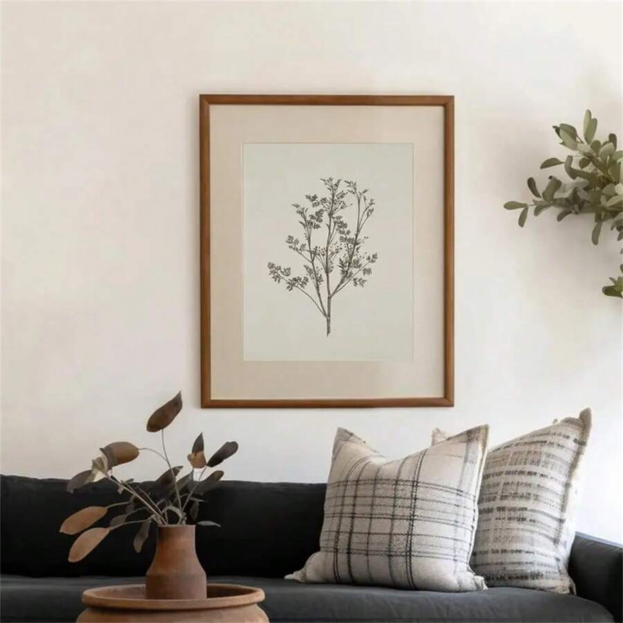 Front wall mockup of two ivory and charcoal botanical prints in distressed gold-tone frames