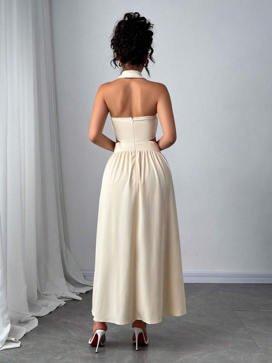 Back view of apricot halter maxi dress showing open back and concealed zipper