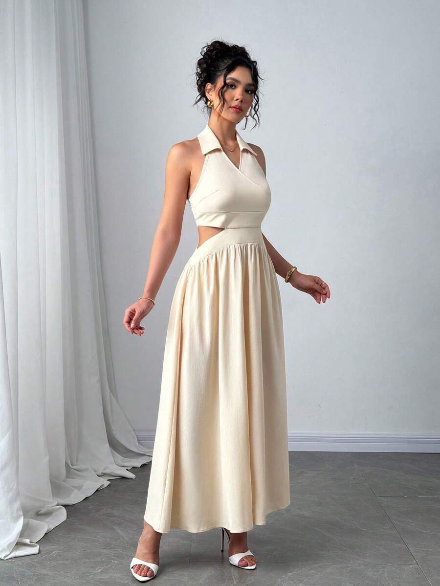 Angled side view of sleeveless apricot cutout maxi dress with flared skirt