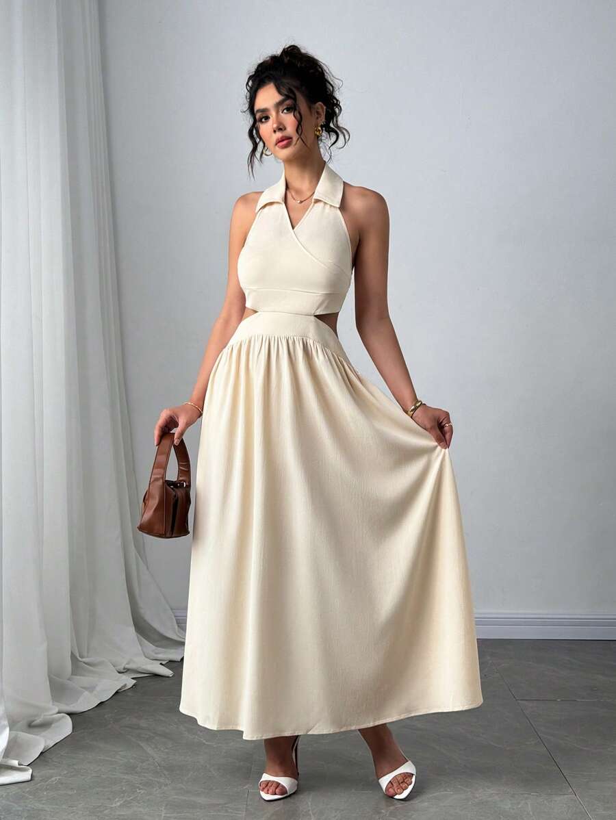 Front full-length view of apricot halter maxi dress with waist cutouts
