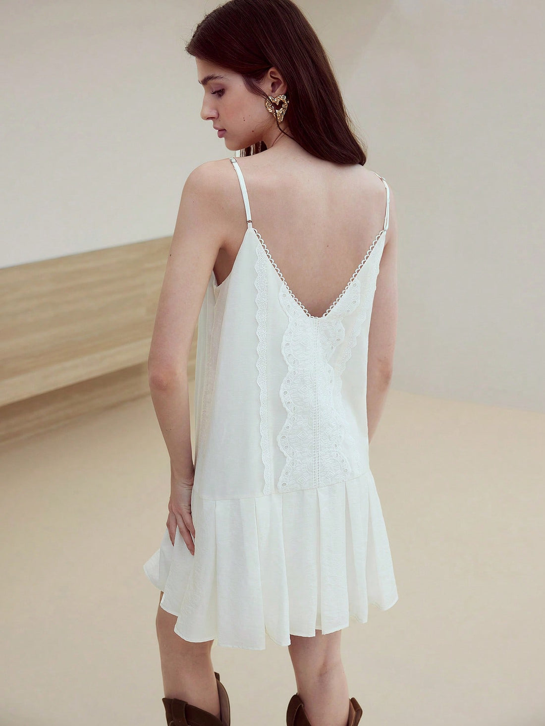 Step into effortless charm with the Embroidered Fold Pleated Cami Dress. Its delicate embroidery and graceful pleats create a playful yet elegant look perfect for any occasion. Lightweight and breezy, this dress moves with you, making style feel easy and fun all day long.