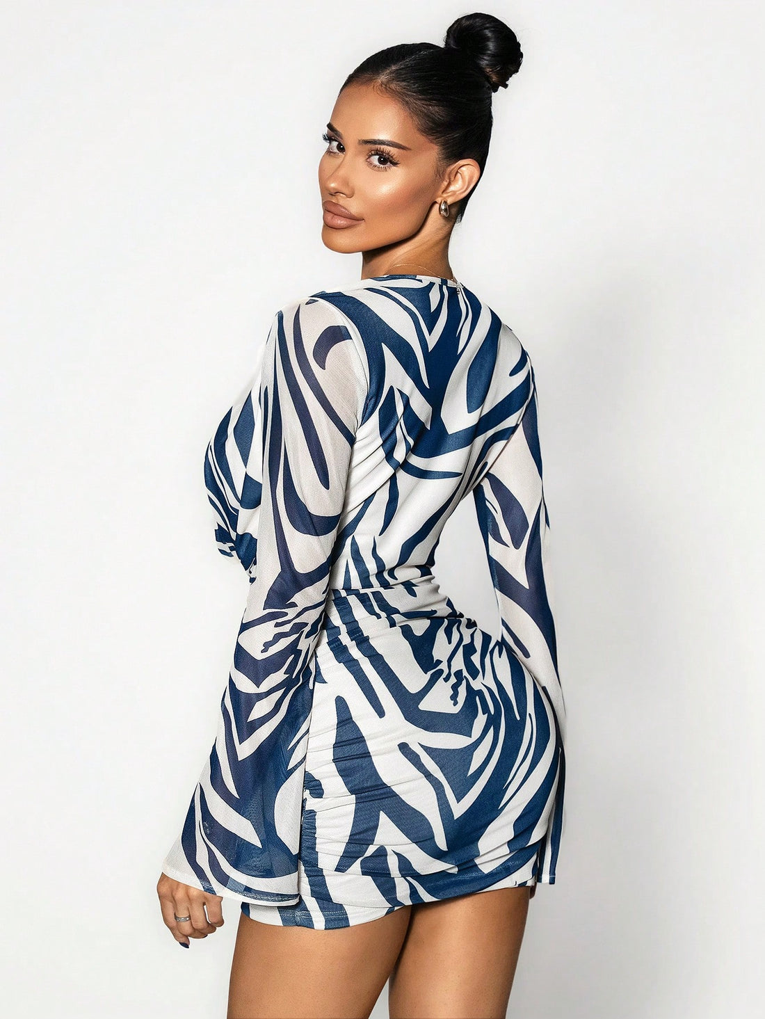 Make a statement this fall with our eye-catching zebra print pleated dress! The dramatic trumpet sleeves and chic swing collar create an instantly polished silhouette that turns heads. Pleated detailing adds movement and dimension, while the bold monochrome pattern brings that trendy edge to your seasonal wardrobe. Perfect for elevating your everyday style or standing out at special occasions. Embrace your fashion-forward side and own the room in this show-stopping piece!