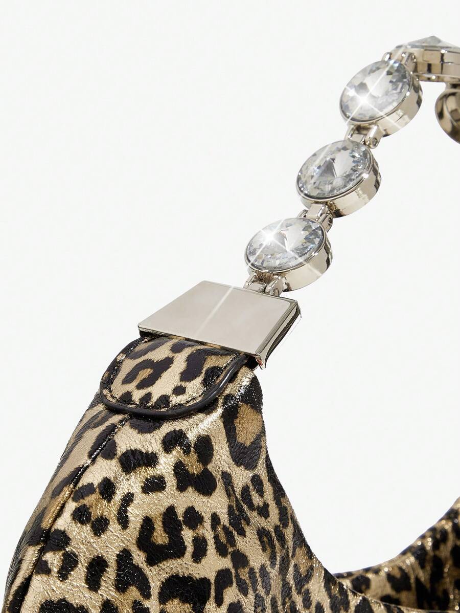 Close-up view of stylish bling leopard print top handle bag for elegant evening events and parties with leopard print, bling finish, top handle for party styling