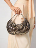 Close-up view of stylish bling leopard print top handle bag for elegant evening events and parties with leopard print, bling finish, top handle for party styling