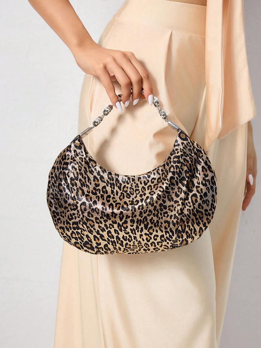 Close-up view of stylish bling leopard print top handle bag for elegant evening events and parties with leopard print, bling finish, top handle for party styling