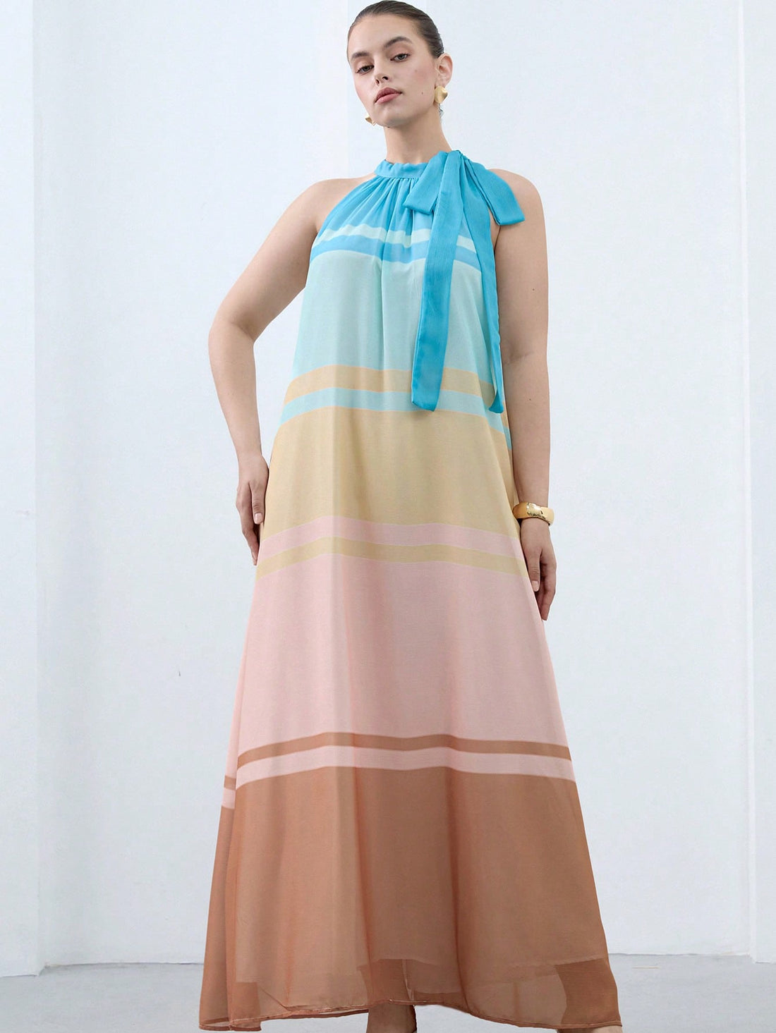 Step into summer with this Chic Plus Size Morandi Tones Halter Dress! Featuring a soft gradient striped pattern in soothing Morandi colors, it’s perfect for beach days or casual outings. The halter design offers a flattering fit while keeping you cool and comfortable. Embrace effortless style and playful vibes wherever you go!