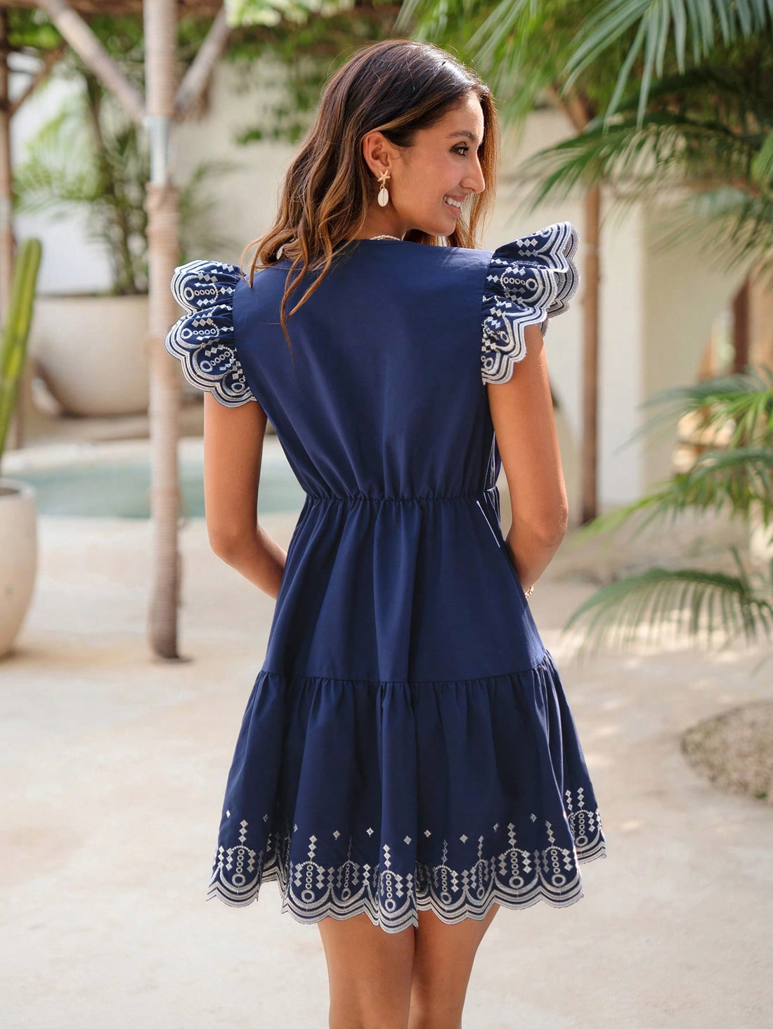 This playful embroidered mini dress features a flattering V-neck and charming winged sleeves, making it your go-to for sunny summer days. Lightweight and breezy, it’s perfect for vacation adventures or casual outings, adding a touch of fun and flair to your warm-weather wardrobe.