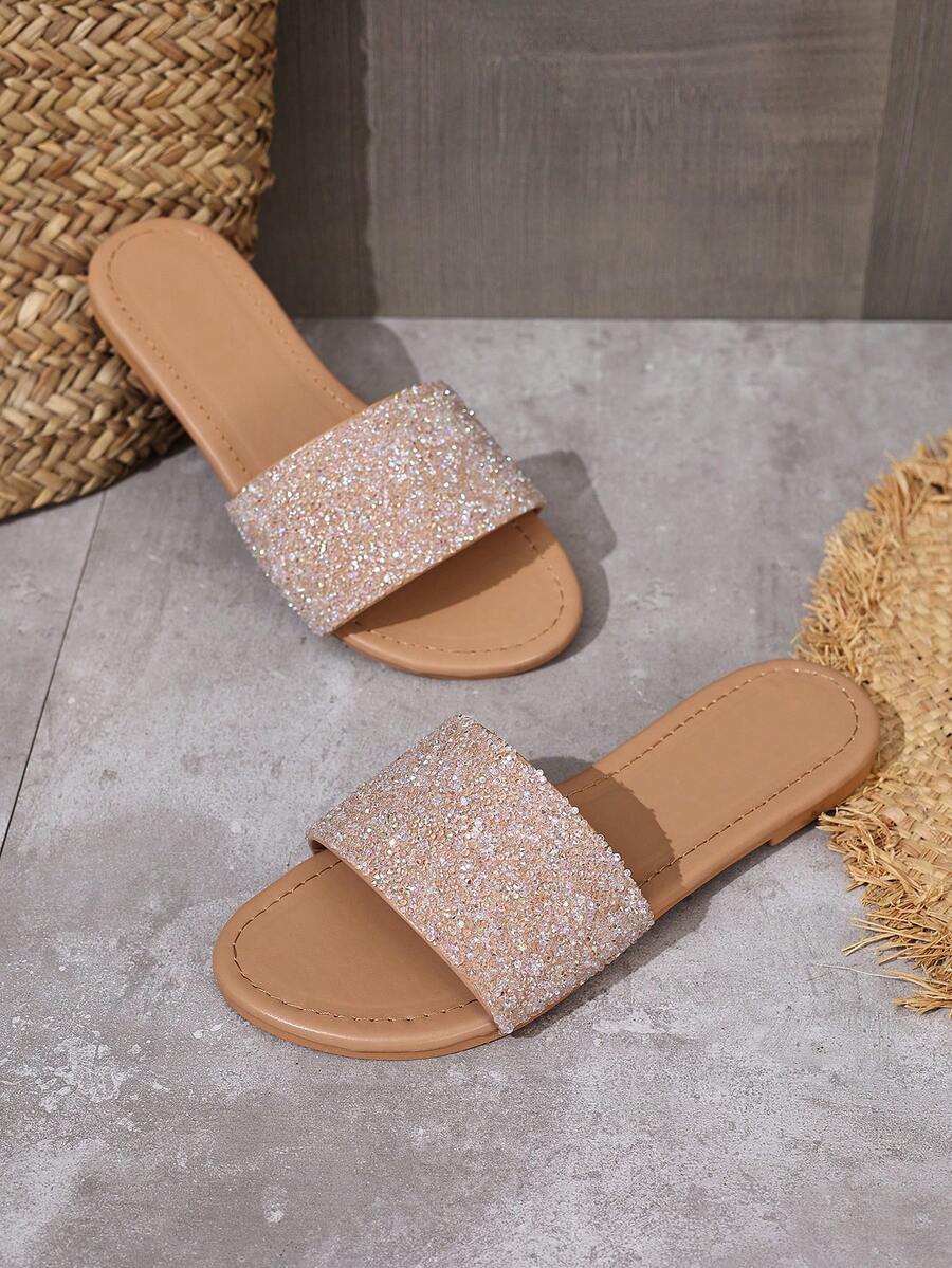 These Khaki Sequin Slip-On Flat Sandals for Women combine a shimmering sequin finish with a comfortable flat sole to ensure every shoe provides style. Designed for the modern woman who values ease, these slip-ons feature a soft khaki fabric that transitions perfectly from a beach day to a casual dinner.