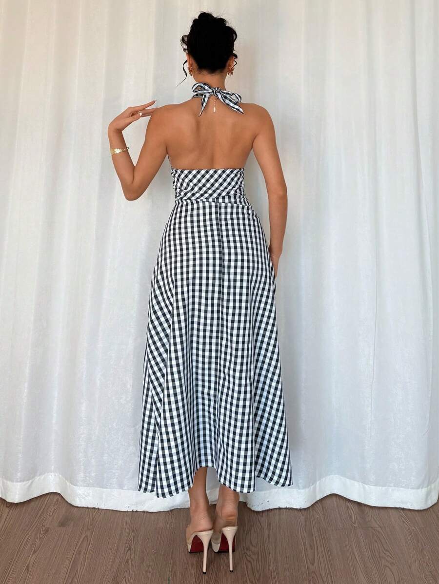 Step into style with our Elegant Backless Halter Long Dress! Featuring a classic black and white plaid design, this dress offers a stylish and comfortable fit. Perfect for any occasion, this dress is sure to turn heads and make you feel confident and chic. Get ready to stand out in this unique and playful piece!