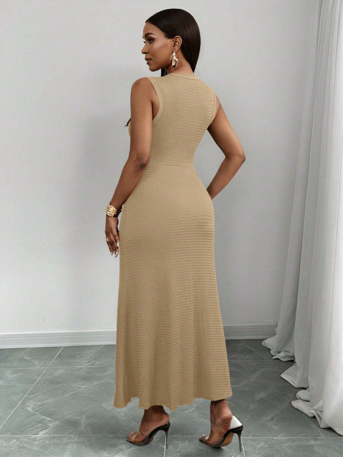 Slip into summer ease with the Easy-Wear Black Maxi! This sleeveless dress features a textured knit that feels as good as it looks. The playful flap detail and shiny metal buckle add a dash of charm, making it perfect for sunny days and breezy nights. Stay cool, comfy, and effortlessly stylish all season long!