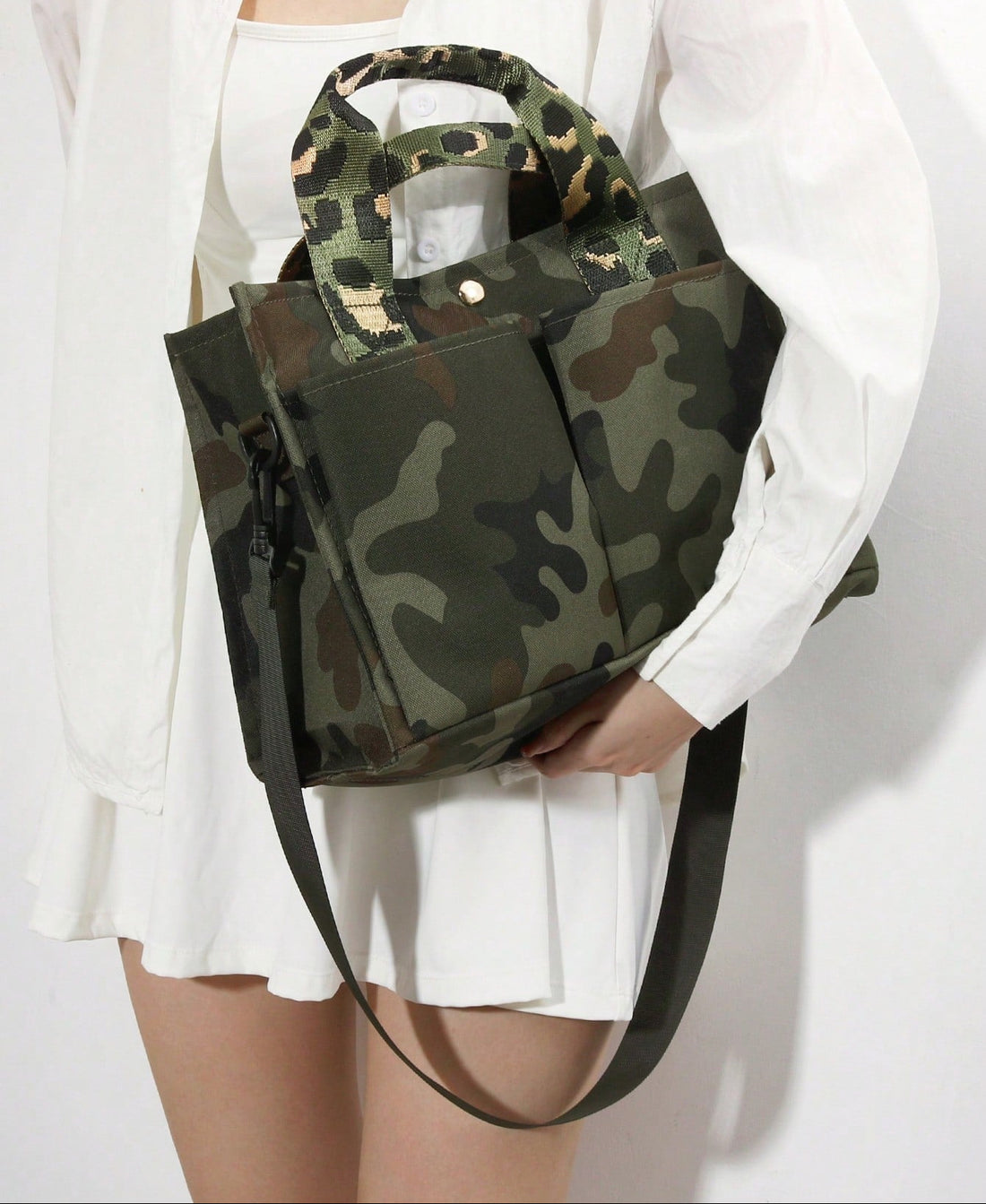 Carry your essentials in style with this eye-catching handmade tote bag featuring a retro camouflage green design. Perfect for commuters and students alike, the spacious interior keeps your daily must-haves organized and accessible. The durable construction and chic aesthetic make it an ideal companion for school runs, office days, or weekend adventures. Whether you're heading to class or catching the train, this versatile bag blends vintage vibes with modern practicality—because looking good shouldn't mean