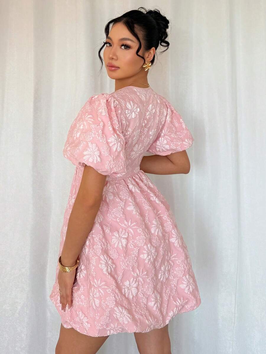 Add some playful elegance to your wardrobe with our Chic Jacquard Floral Balloon Sleeve Mini Dress. The A-Line style adds a flattering touch while the vibrant floral pattern and balloon sleeves make a stylish statement. Perfect for any occasion, this dress will have you feeling chic and confident!