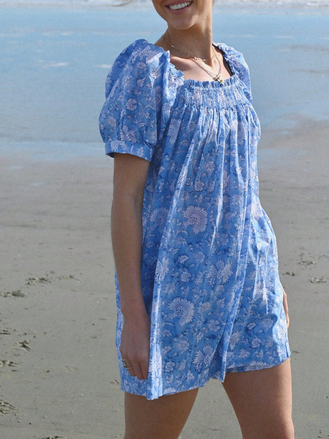 Step into summer fun with this playful floral short skirt dress! Featuring charming bubble sleeves and a flattering square neckline, it’s perfect for casual vacations and sunny days. The light, breezy fabric keeps you cool while the vibrant floral print adds a splash of joy to your look. Easy to dress up or down, this dress is your go-to for effortless style and comfort wherever your adventures take you.