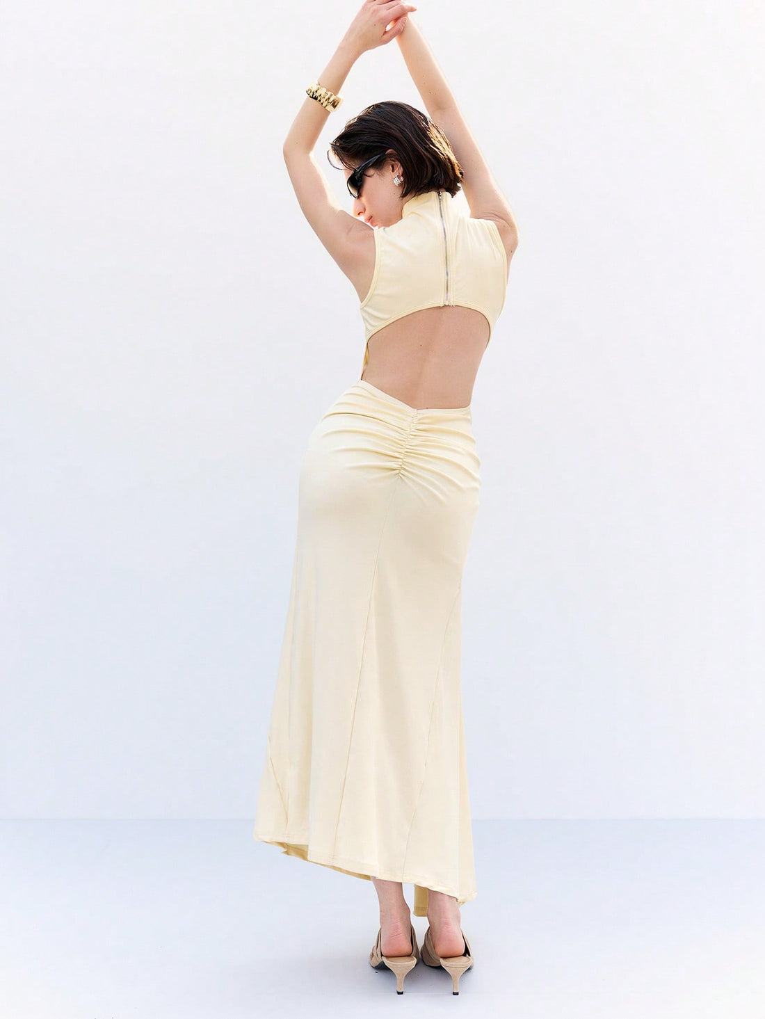 Step into sunshine with this playful cream yellow long skirt, adorned with charming starfish metal accents. Its backless design keeps you cool and flirty, making it the perfect choice for spring and summer days. Whether you're strolling the beach or dancing at a garden party, this skirt adds a breezy, elegant touch to your wardrobe.
