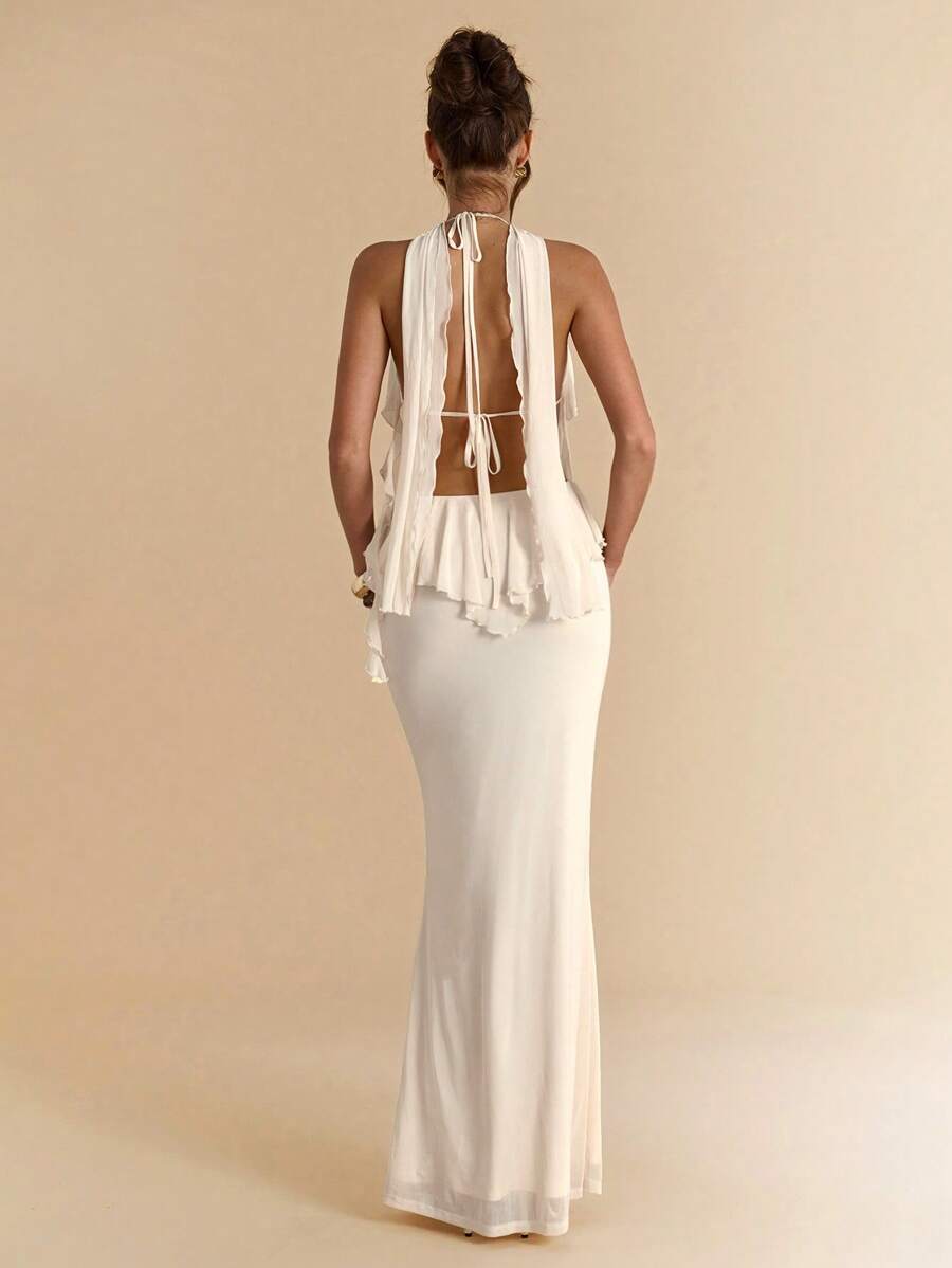 Exude Sun-Drenched Sophistication in Our Chic Yellow Floral Print Halter Dress!

Experience the breathtaking fusion of vibrant island heritage and sharp, modern architectural tailoring. This stunning yellow floral halter dress is meticulously designed for the woman who values a high-fashion, "quiet luxury" approach to resort wear—the ultimate centerpiece for prestigious beachside brunches, exclusive tropical retreats, and high-authority summer social gatherings.

Iconic Floral Artistry: Featuring a masterfu