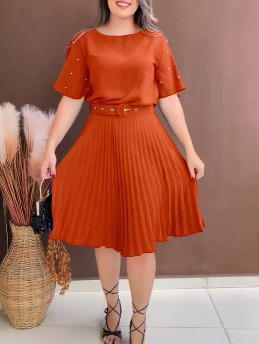 Step out in style with this playful pleated dress featuring chic pearl accents and a ruched waist that flatters every figure. The included belt adds a touch of elegance while defining your silhouette, making it perfect for any occasion—from brunch dates to evening soirees. Embrace effortless charm and comfort all day long.