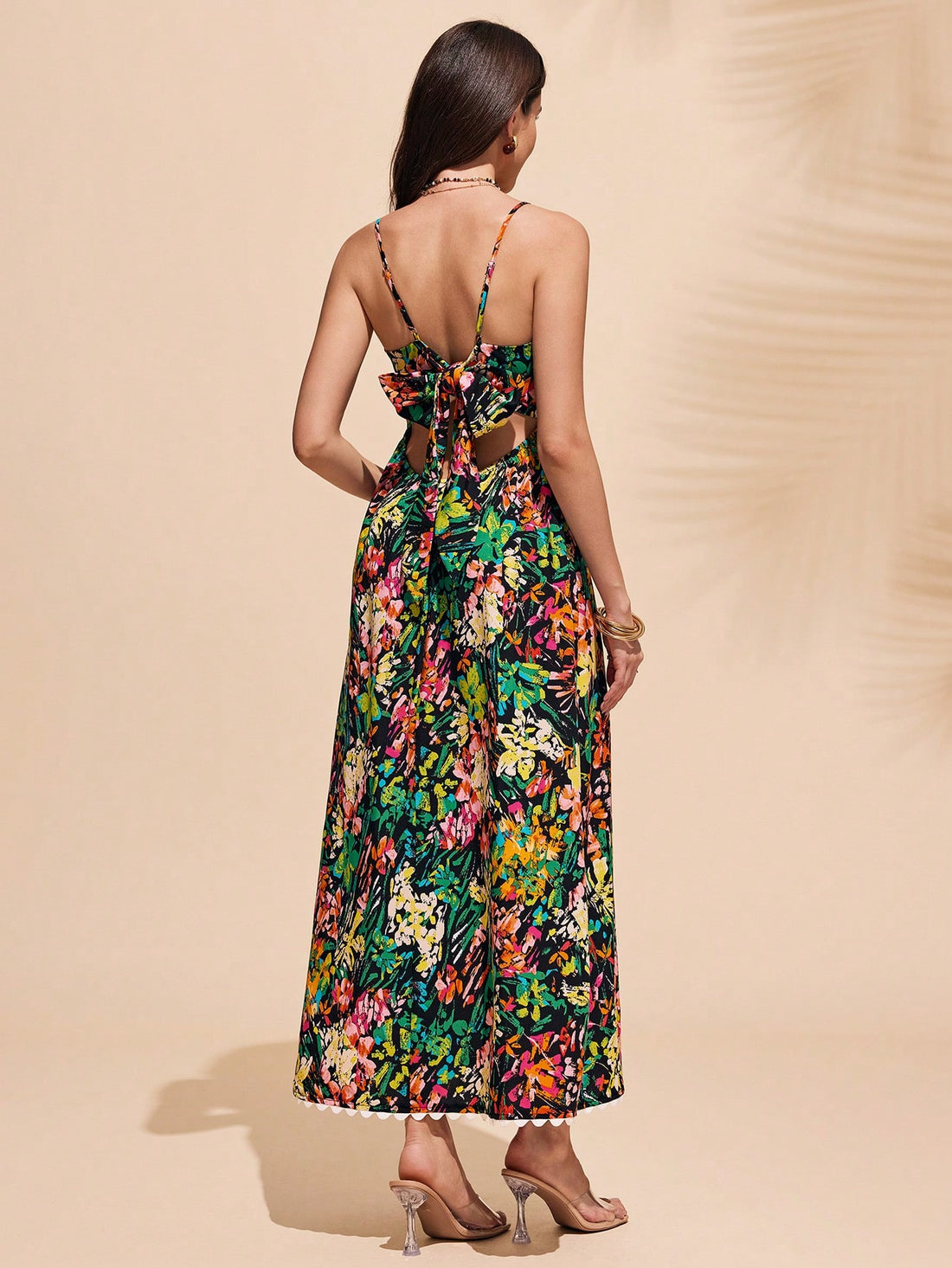 Get ready to turn heads with this elegant spaghetti strap beach dress! Perfect for any holiday outing, this dress is sure to keep you cool and stylish. With its delicate straps and flowy design, you'll feel like a true fashion icon. So go ahead and make a statement with this must-have dress!