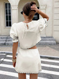 Back view cream two piece set with puff sleeves, scalloped trim, and keyhole tie crop top