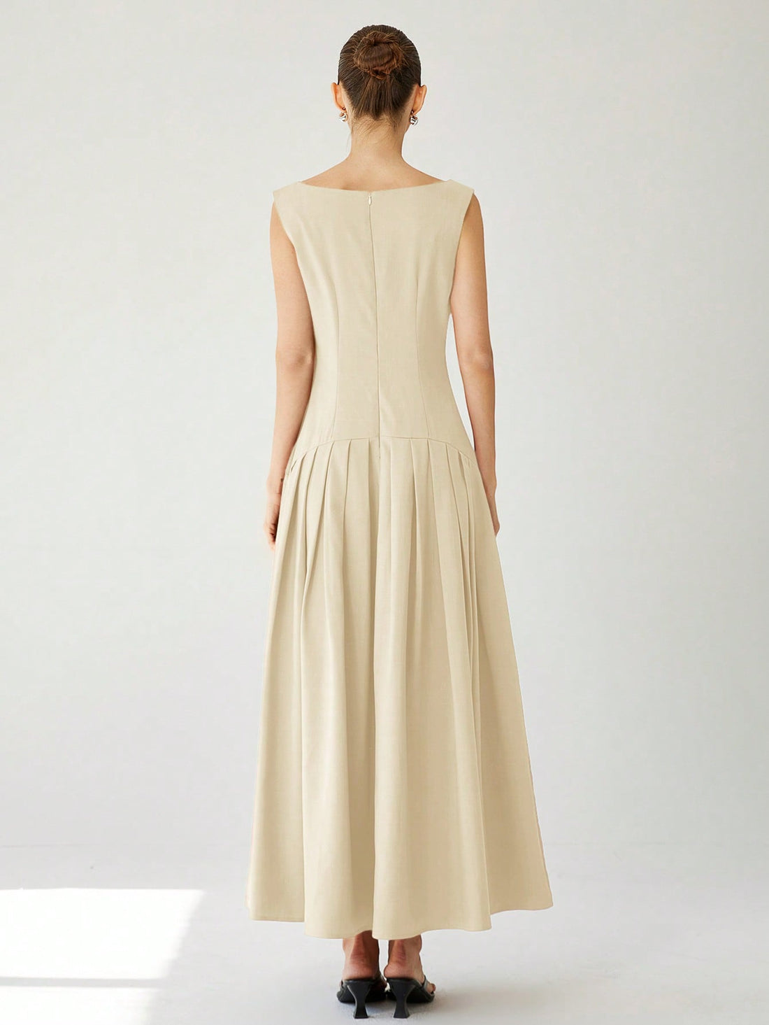 Turn heads this Valentine's Day in our elegant sleeveless red dress, featuring a flirty ruffle trim and a charming ruched hem. Its playful design hugs your silhouette while adding a touch of fun and romance to your look. Perfect for dancing the night away or a cozy dinner date, this dress brings out your confident, vibrant side with every step.