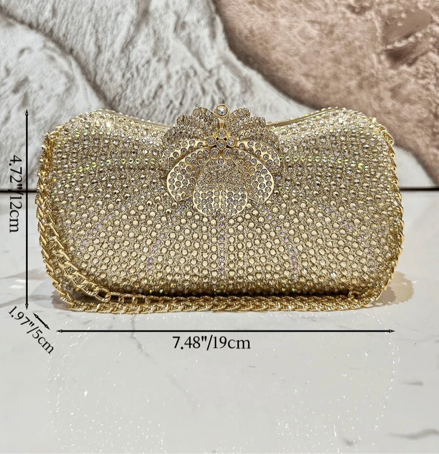 Add a pop of sparkle to your outfit with this Glamorous Rhinestone Rainbow Clutch Bag. Perfect for weddings or fancy nights out, its dazzling rhinestones catch the light beautifully while the rainbow hues keep things fun and lively. The crossbody design lets you dance the night away hands-free, making it a stylish and practical choice for your next special event.