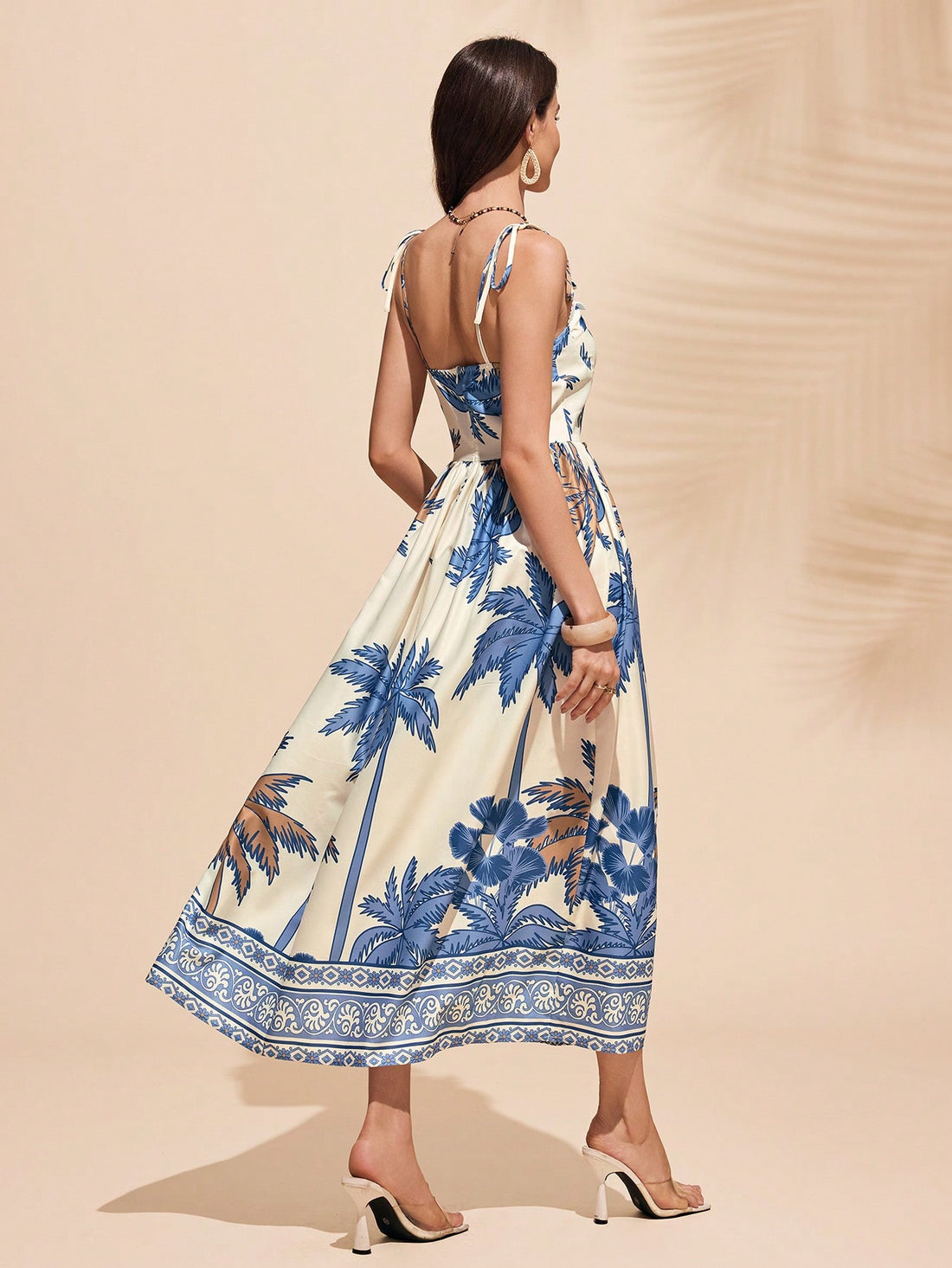 Get ready to make a statement at the beach with this Elegant Blue Floral Print Dress. Perfect for beach holidays, this dress combines style and comfort in one playful package. Embrace your unique sense of fashion with ease in this must-have dress!