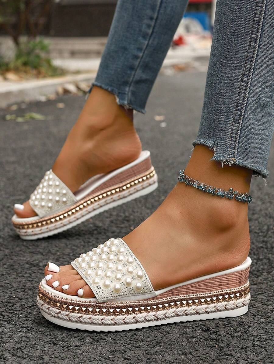 Step into summer with these playful wedge sandals featuring a charming bowknot and stylish rivets. Their boho open-toe design keeps your feet cool and comfortable, perfect for sunny days and casual outings. Elevate your look effortlessly while enjoying all-day wearability.