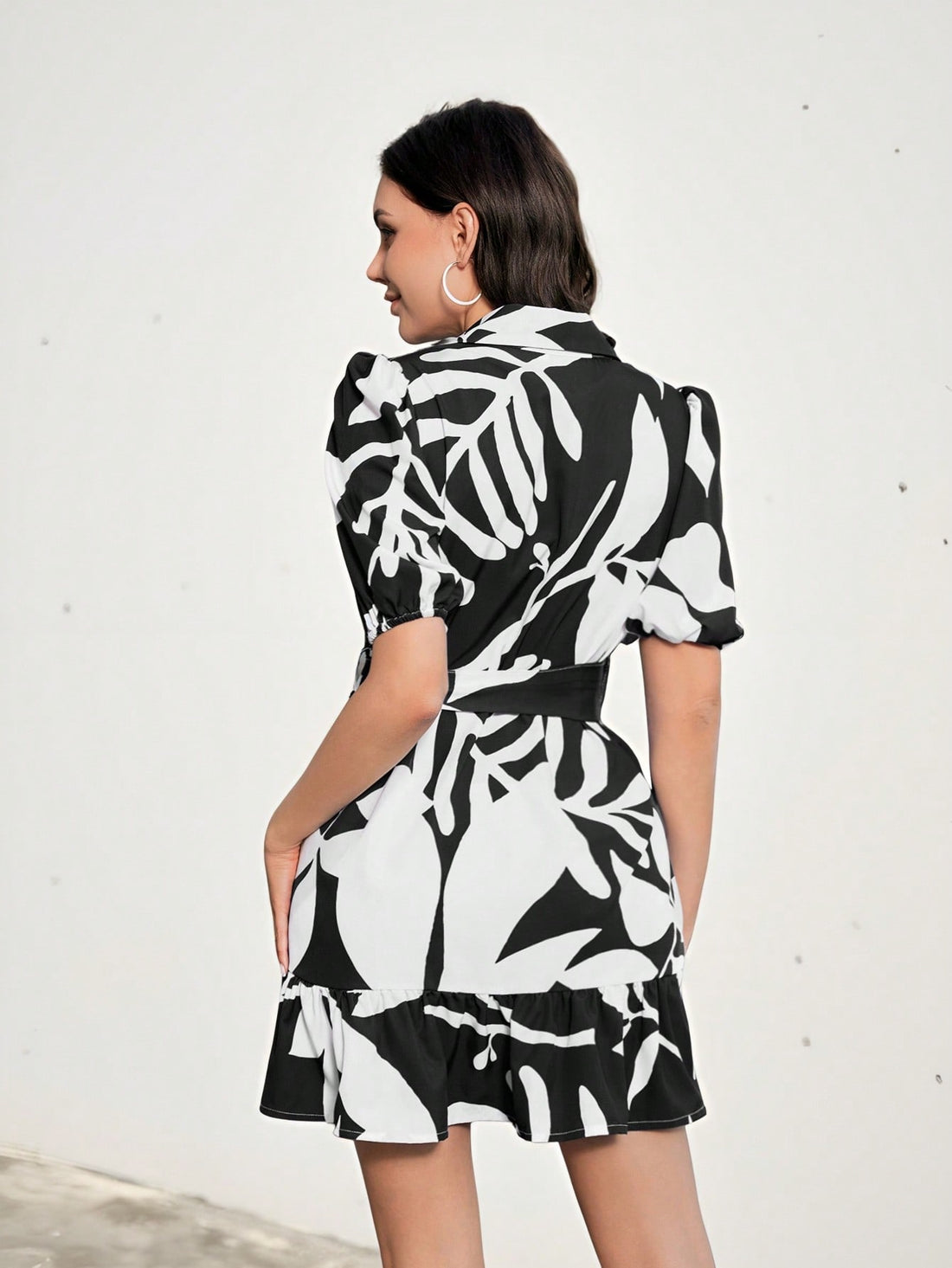 Step out in style with this playful mini shirt dress featuring charming ruffled sleeves and a lively random floral print. Perfect for casual days, its breezy fit offers comfort while adding a touch of effortless charm to your look. Whether you're brunching with friends or enjoying a sunny stroll, this dress brings fun and flair to your wardrobe.